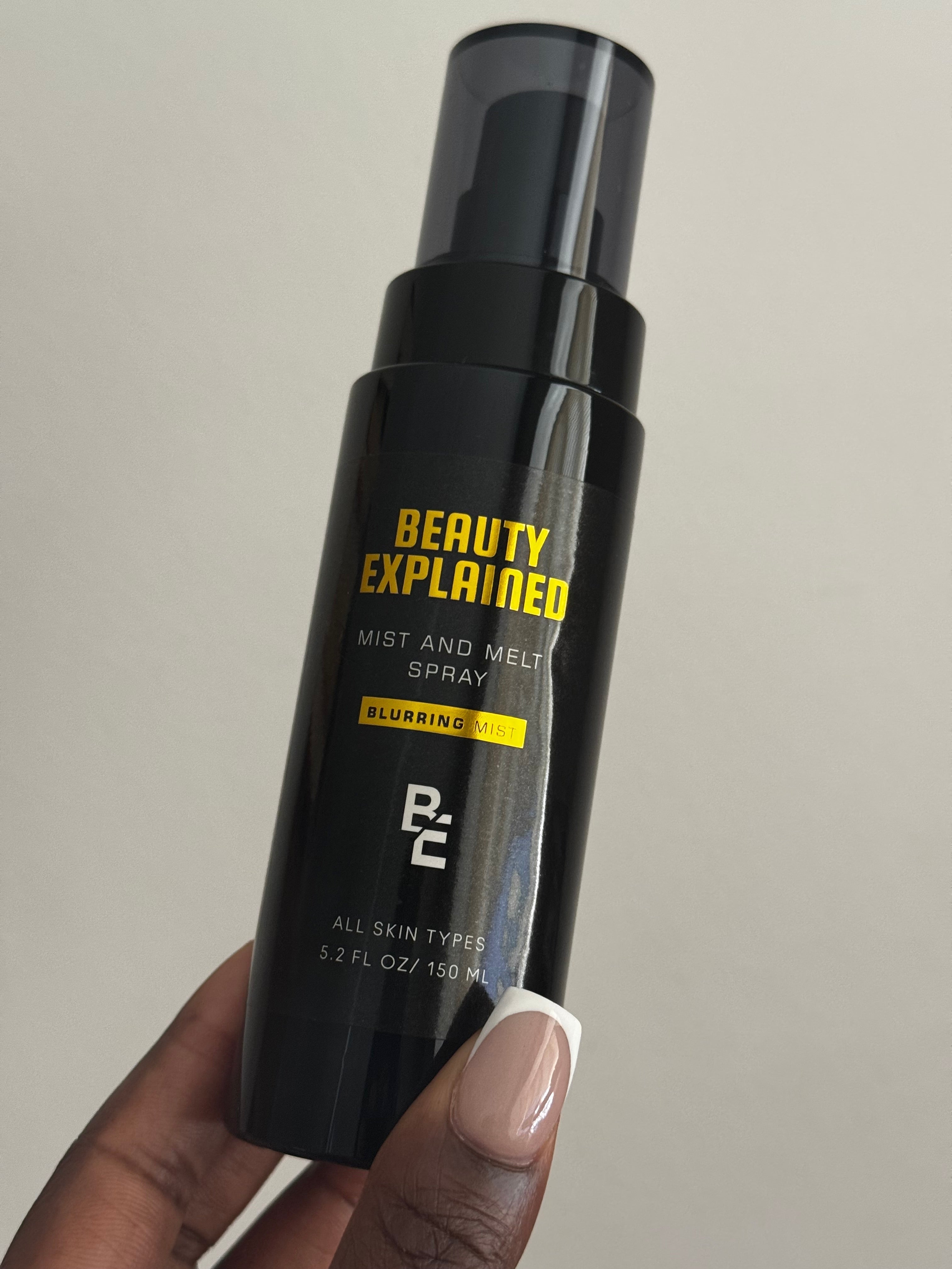 Professional makeup artist demonstrating non sticky setting spray techniques