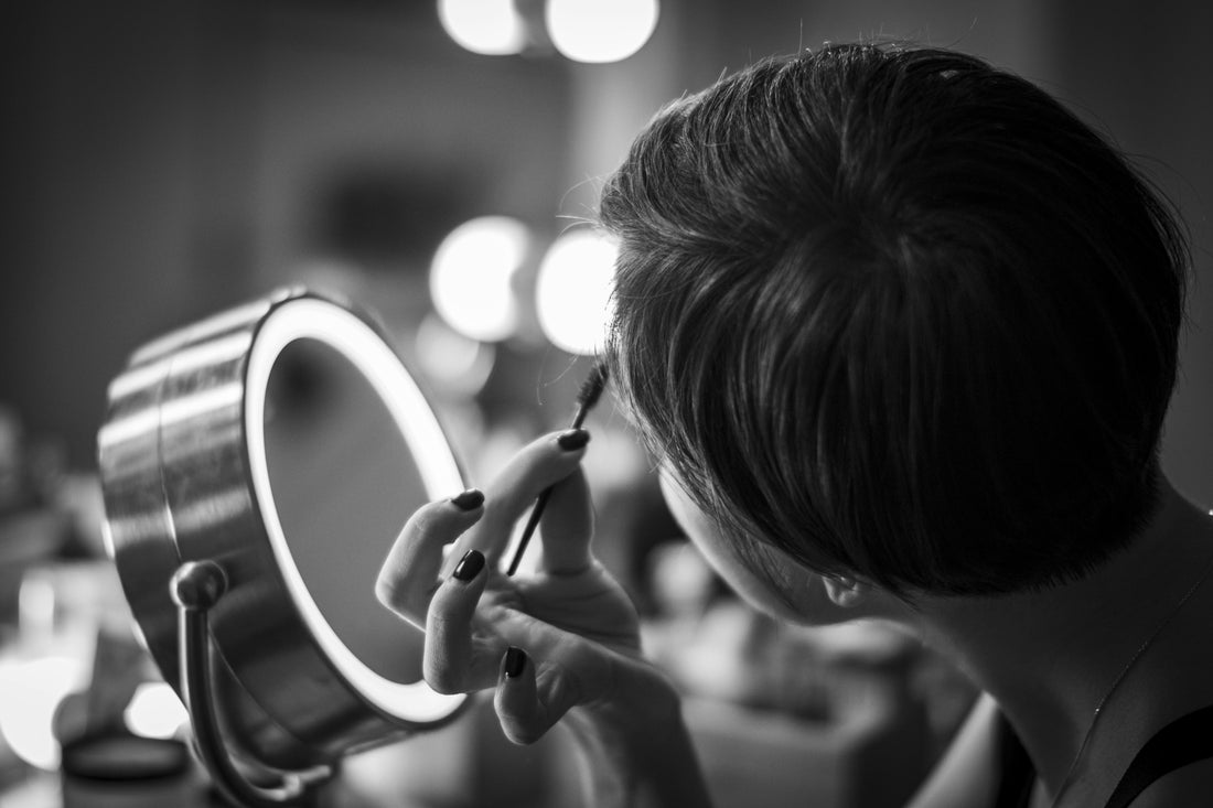 Woman applying setting spray after powder for a smooth, melted makeup finish